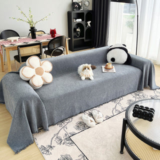 Woven sofa throw, Zinc grey, draped over a sofa