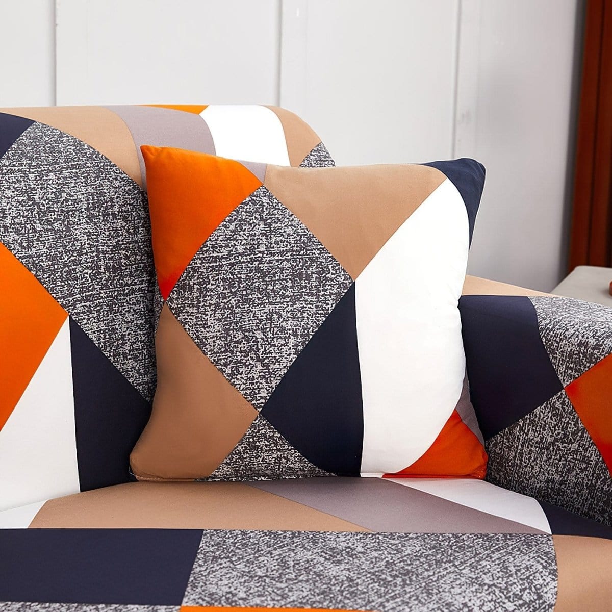 Stretch cushion covers 45 × 45 cm (18 in), pack of 2, Orange and navy patchwork, fitted on a sofa