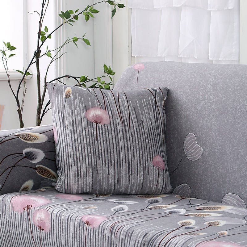Water-repellent cushion covers 45 × 45 cm (18 in), pack of 2, Grey with pink pom-poms, fitted on a sofa